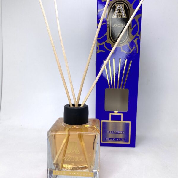 Reed diffuser with Azora fragrance in elegant glass bottle, ideal for home scenting.