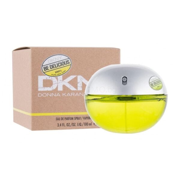 Elegant DKNY Be Delicious perfume bottle with yellow liquid and silver cap.