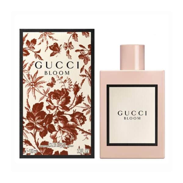 Elegant Gucci Bloom perfume bottle with floral packaging.