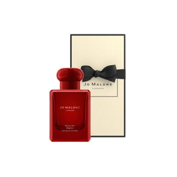 Jo Malone Scarlet Poppy perfume in a red bottle with a black bow, elegant packaging.