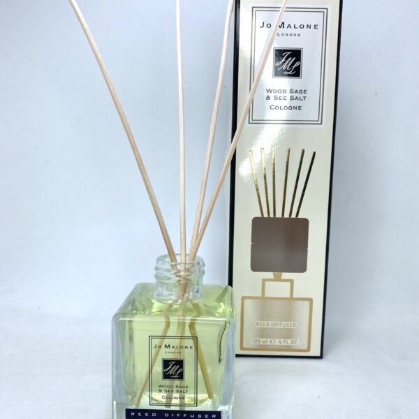 Diffuser with Wood Sage & Sea Salt scent in a glass bottle.