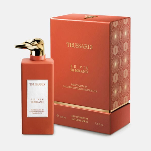 Trussardi Le Vie di Milano perfume bottle with gold dog head cap, in front of its matching box.
