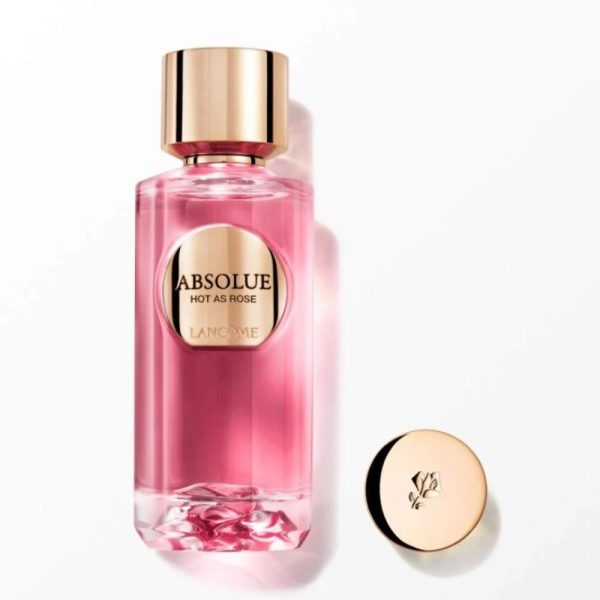 Elegant Lancôme Absolue Hot As Rose perfume bottle with pink liquid and gold cap.